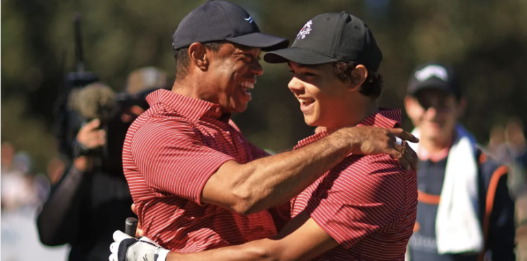 Tiger Woods of the United States reacts with his son Charlie Woods after making the first hole-in-one of his career on the fourth hole during the second round of the PNC Championship at Ritz-Carlton Golf Club on December 22, 2024 in Orlando, Florida. (Photo by Mike Ehrmann/Getty Images)